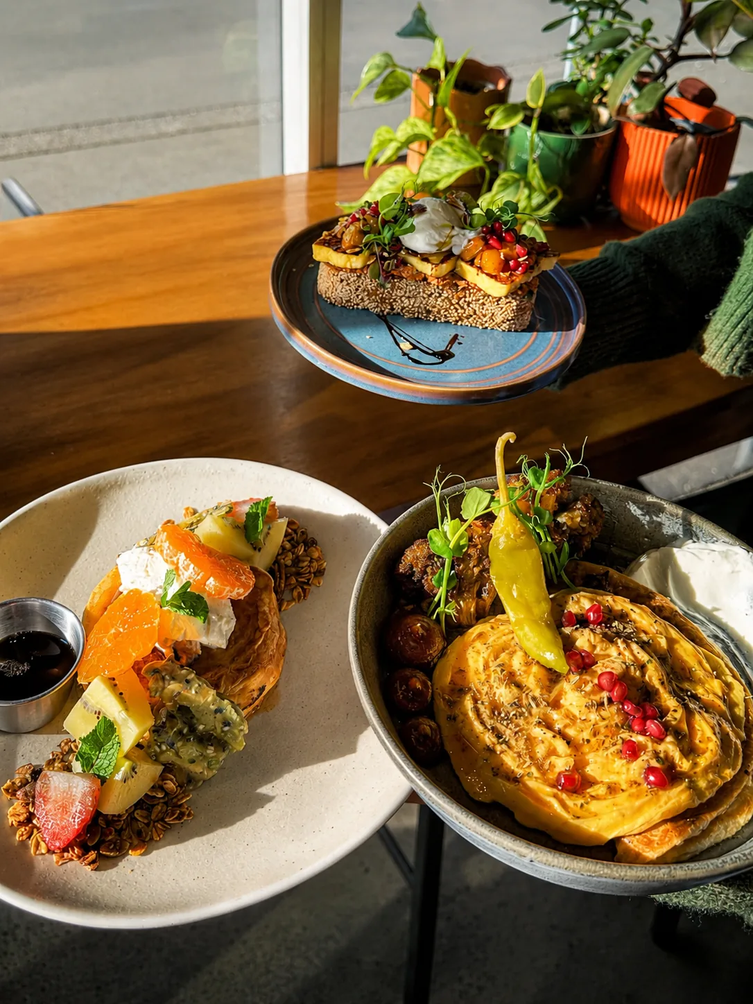 A selection of colourful Heirloom plates in the café sunlight